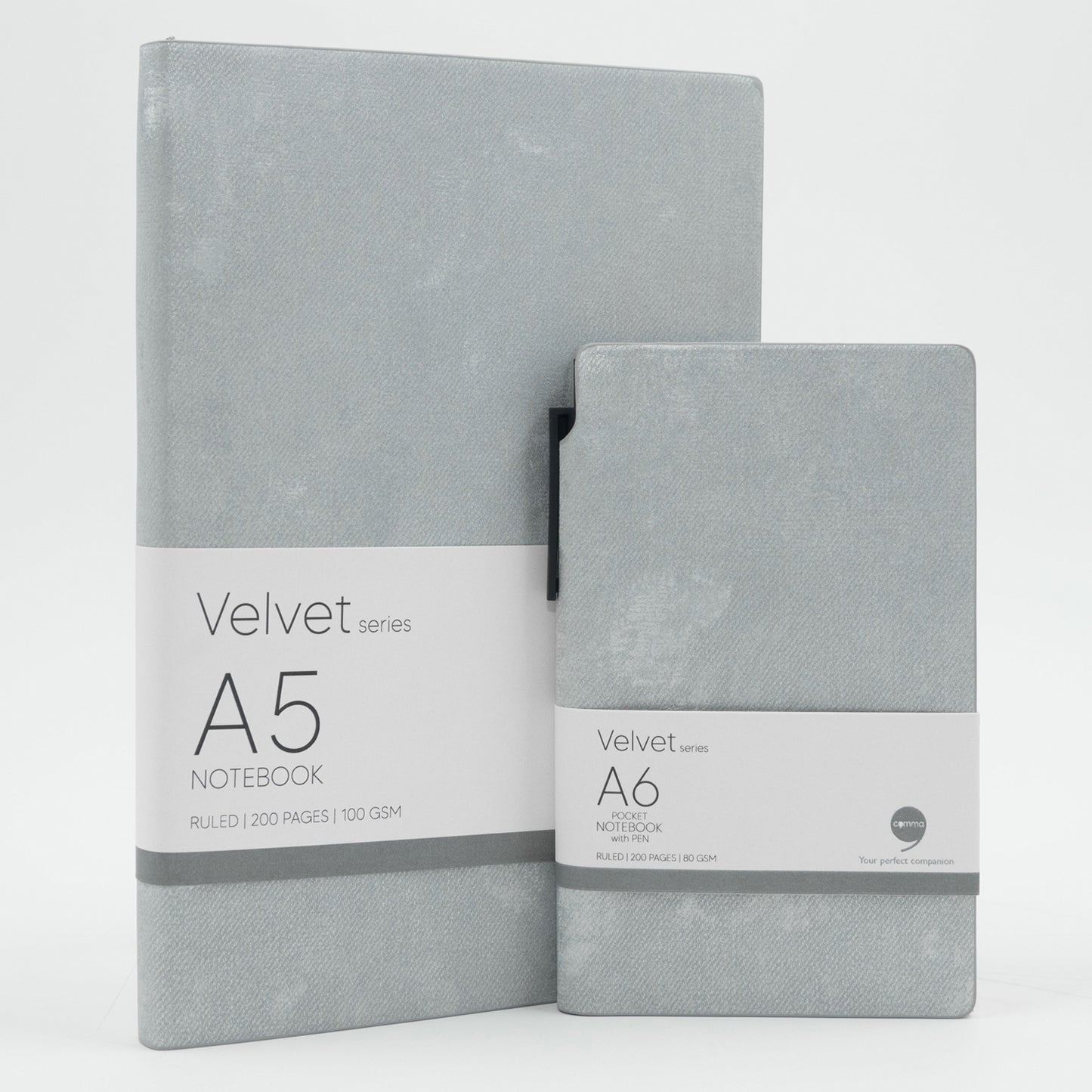 A set of two grey velvet notebooks, one A5 size and one A6 size, with a grey ballpoint pen and labeled 'Velvet Series A5' and 'Velvet Series A6' respectively.