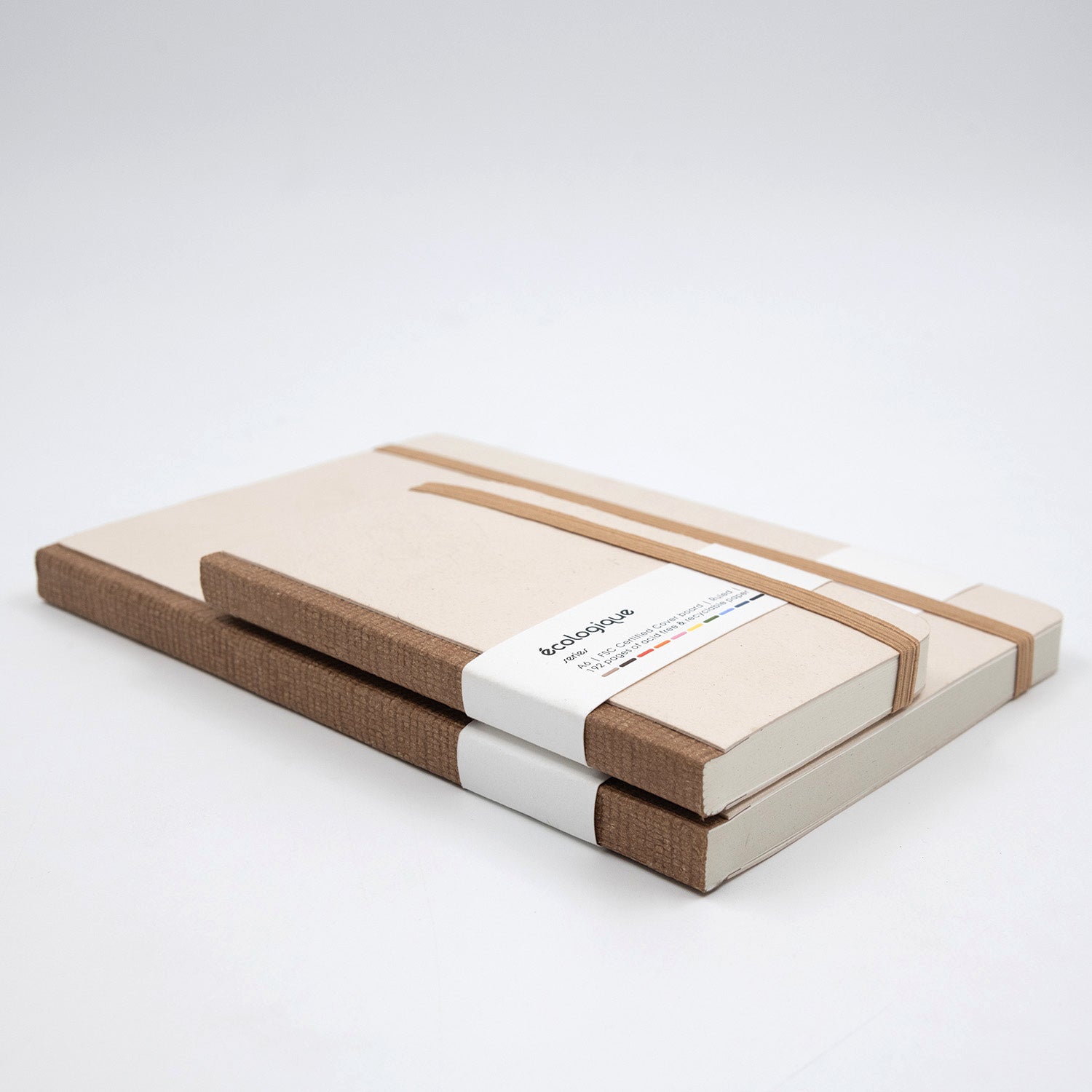 Stack of cardboard boxes with a visible brand label on a white background