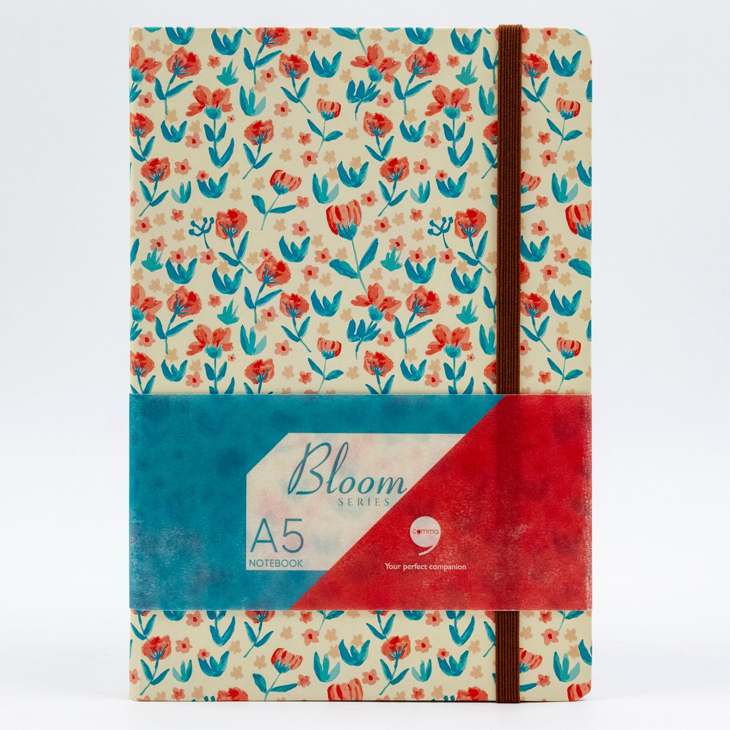 A5 size hard bound notebook with a floral design and a red and blue elastic band.