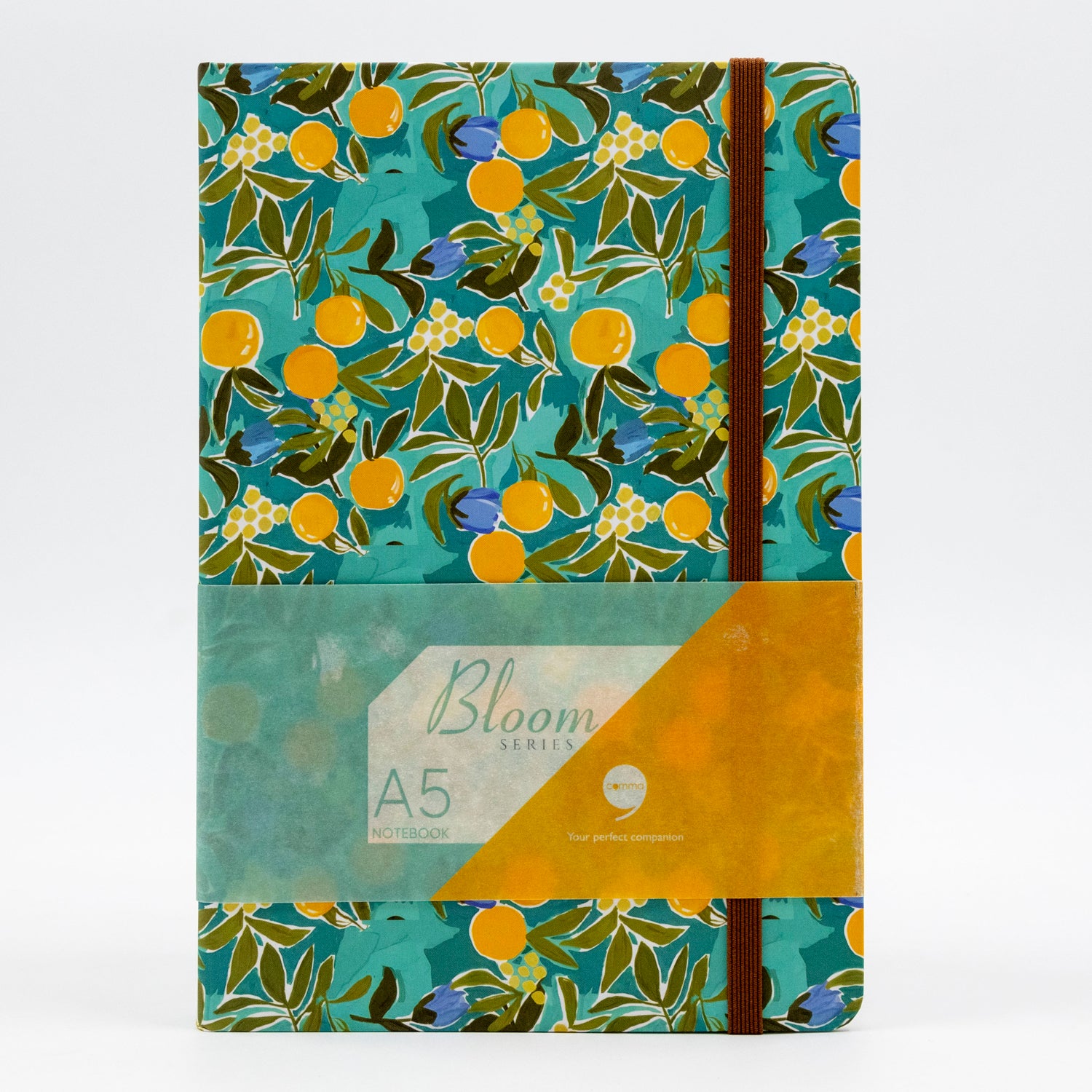 A5 size hard bound notebook with a blue cover featuring a nature-inspired floral design and a brown elastic band for securing the pages.