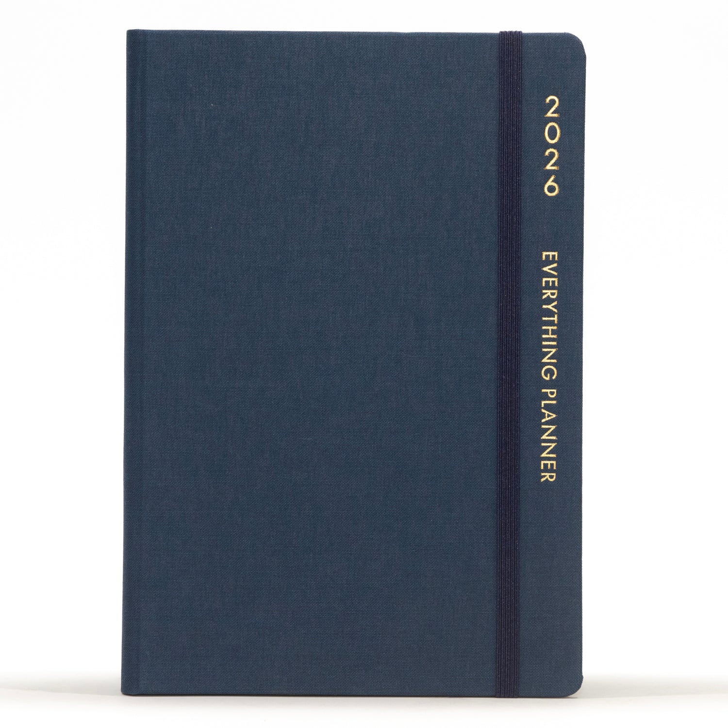 Navy blue planner with 'COMMA' branding on a white background