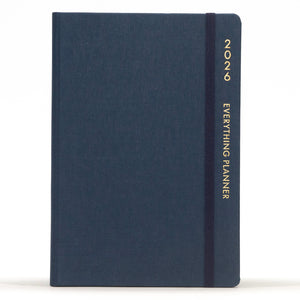 Navy blue planner with 'COMMA' branding on a white background