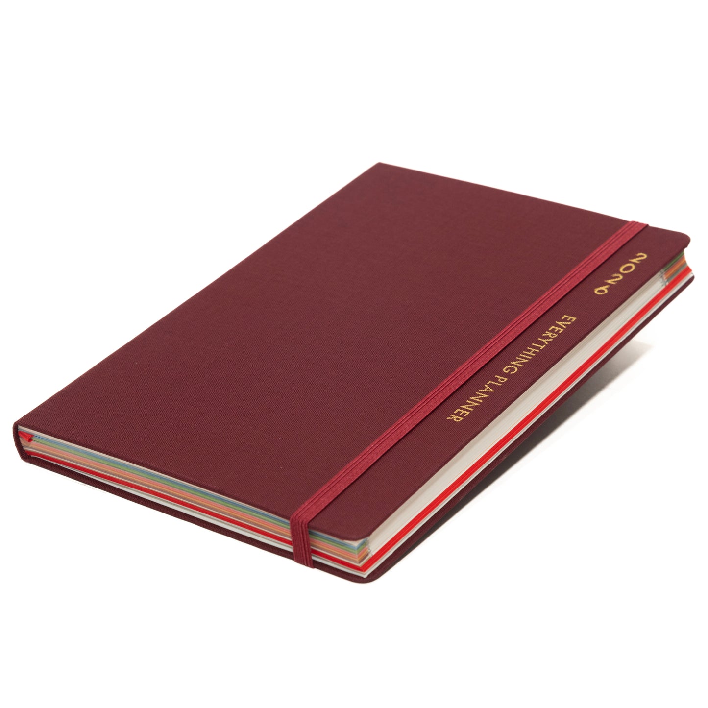 Maroon notebook with gold text on a white background
