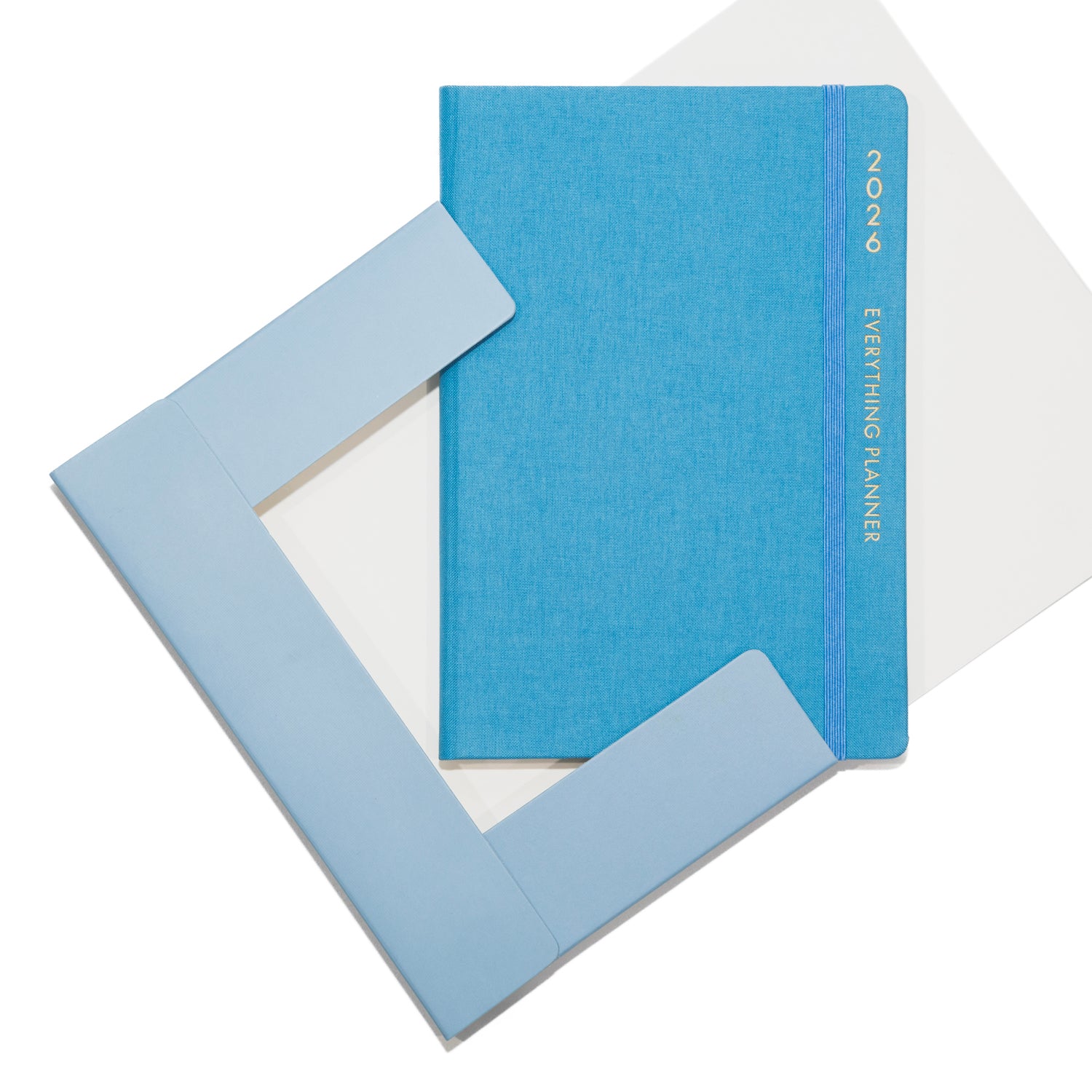 Blue planner with a matching cover on a white background