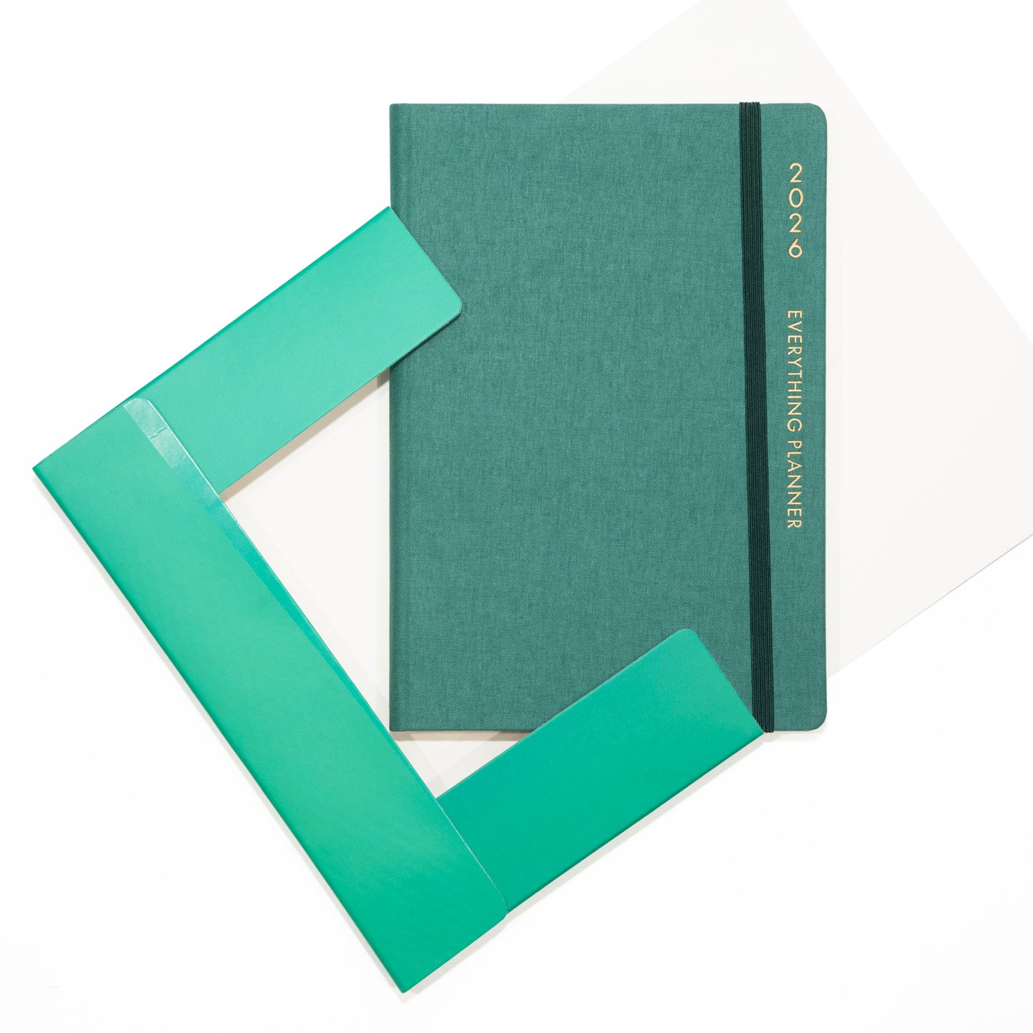 Green planner with a matching green cover on a white background