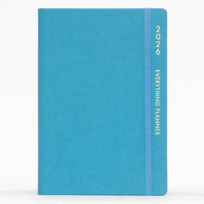 Blue planner with 'COMMA' branding on a white background