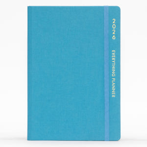 Blue planner with 'COMMA' branding on a white background