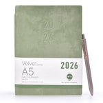 Load image into Gallery viewer, Green planner with &#39;2026&#39; embossed on it, featuring a pen on a white background
